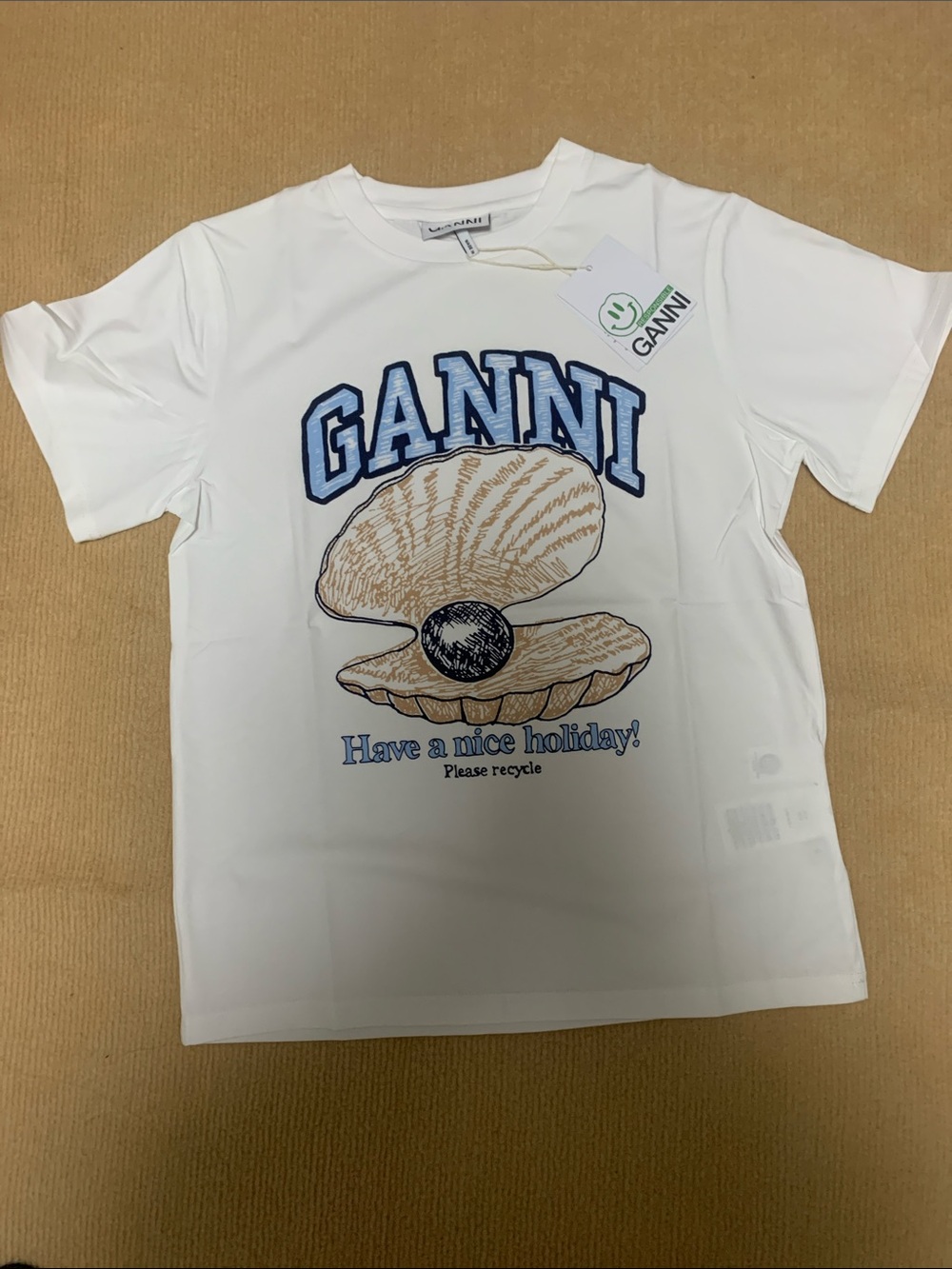 Ganni White Tee with Blue Logo and Tan Shell Graphic